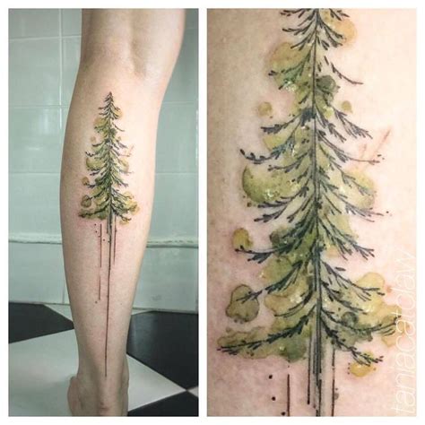 An Image Of Tattoos On The Back Of A Persons Leg With Pine Trees