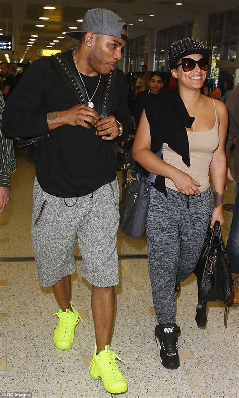 Nelly Keeps His Muscular Arm Around Girlfriend Shantel Jackson As He