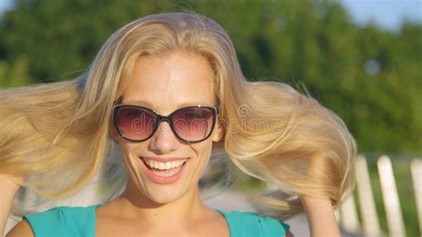 Portrait Cheerful Caucasian Woman Plays With Her Beautiful Long Blonde Hair Stock Image
