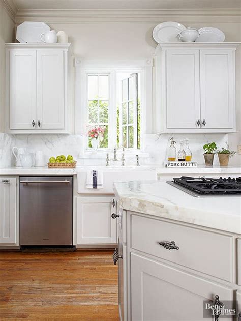 And depending on how tall your cabinets are, there can be one more thing to keep on top of. decorating above kitchen cabinets {10 ways}