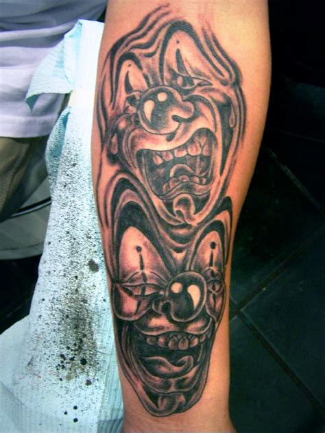Dont forget to rate and comment this tatto!! Happy Sad Clown Faces Tattoo On Arm » Tattoo Ideas
