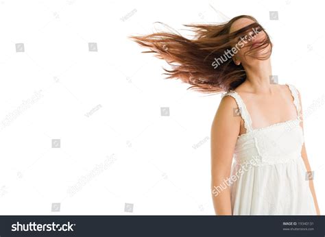 Young Attractive Girl Shaking Her Head With Hair On The Move Against White Background Stock