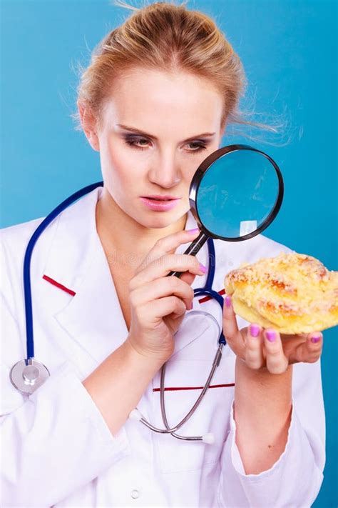 Doctor With Magnifying Glass Examining Sweet Food Stock Image Image