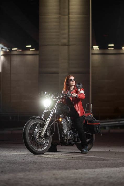 Girl Biker Sexually Posing On Motorcycle At Night City Stock Photo