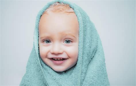 Premium Photo Smiling Beautiful Baby Bathing Under A Shower At Home
