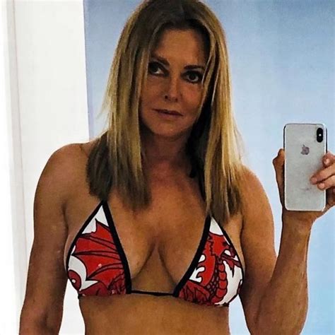 Carol Vorderman Shows Off Hourglass Curves In Plunging Swimsuit For