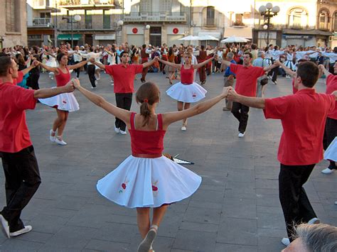Group dancing sardanes in barcelona. Sardana, a traditional Catalan dance - ShBarcelona