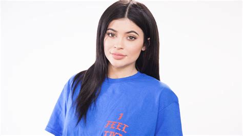 Download Kylie Jenner Wearing Blue Shirt Wallpaper
