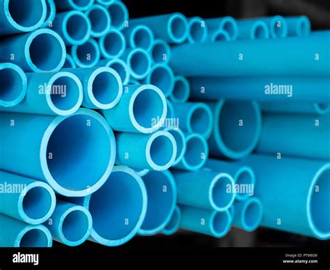 Tubes Pvc Pipes Stacked In Warehouse Blue Pvc Pipes Background Stock
