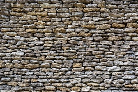 Premium Photo Background Of Limestone Walls Densely Piled Stones