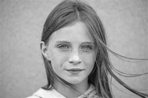 Beautiful Blond Young Girl With Freckles Outdoors On Wall Background Closeup Portrait Black