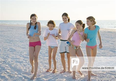 Group Of Girls Dancing On Beach