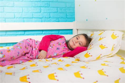 Little Girl In Pajamas Lying In Bed In The Morning Stock Image Image