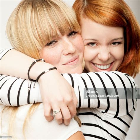 Red And Blond Haired Girls Laughing And Hug Stock Photo Download