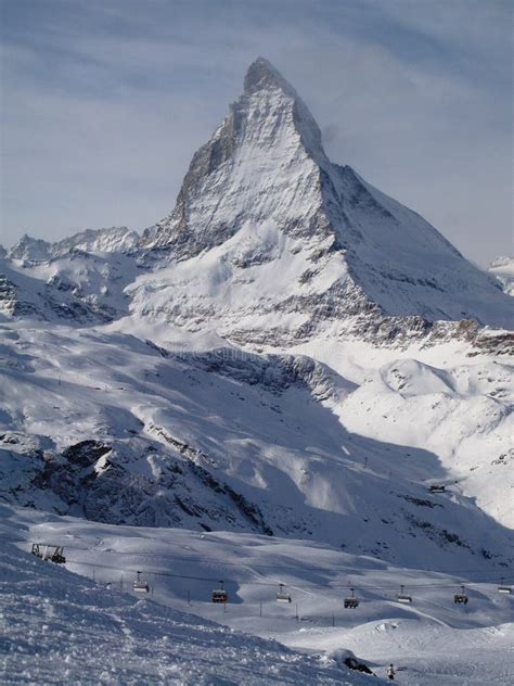 The Majestic Alpine Matterhorn Mountain Towering Above The Town Of