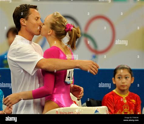 american gymnast nastia liukin is kissed by her father valeri after final scoring gave her the