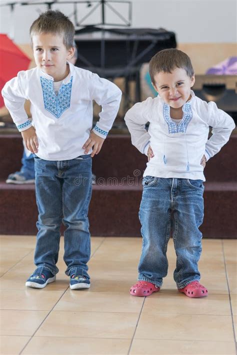 Two Little Boys Perform On Stage In Kindergarten Or School Performance