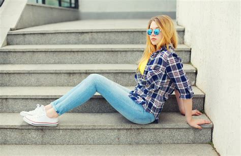 Pretty Young Girl Wearing A Checkered Shirt And Sunglasses Stock Image