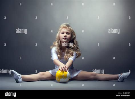 Fascinating Little Gymnast Posing On Split Stock Photo Alamy