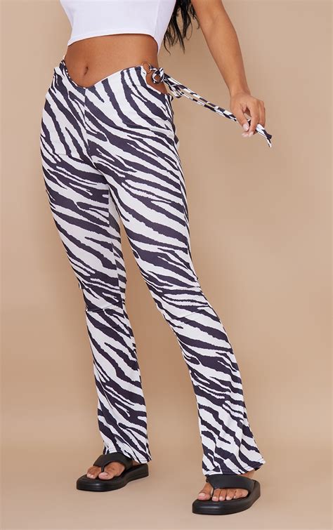 Black Zebra Printed Cut Out Detail Flare Trousers Prettylittlething