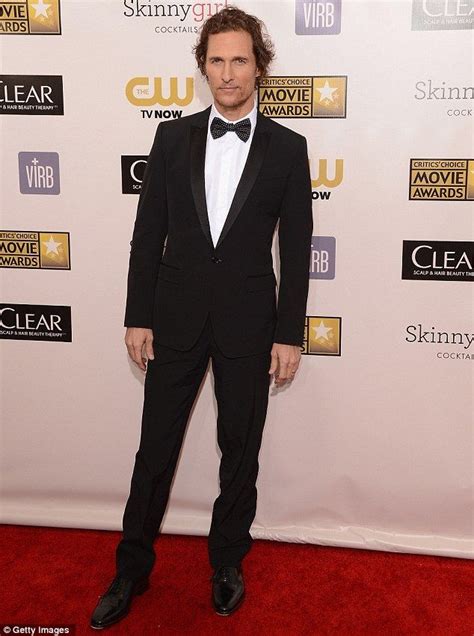 A Man In A Tuxedo And Bow Tie On The Red Carpet At An Event