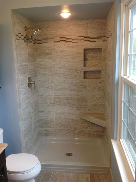 Love the look of subway tile, but not sure how to make it work in a small bathroom? Marazzi Silk Elegant 12x24" tiles in a 34x48" shower space ...