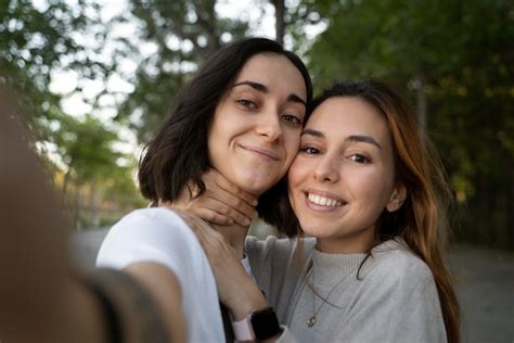 free photo lesbian couple taking a photo together