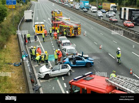 Emergency Services Attending A Nasty Road Traffic Accident On A Motorway As Traffic Tails Back