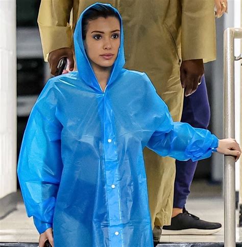 Bianca Censori Displays Boobs In Sheer Raincoat With Only Underwear Beneath
