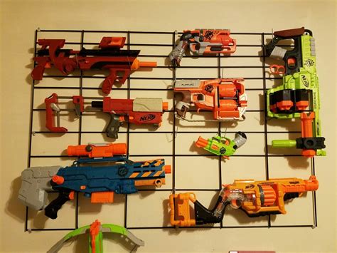 Sheet of pegboard (size will vary based on your needs) spray paint; Diy Nerf Gun Wall Rack : No more nerf darts and guns lying everywhere.