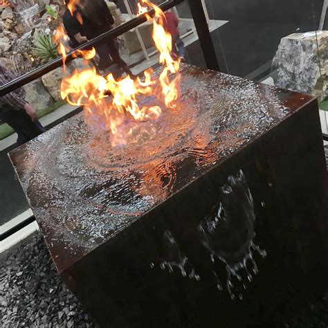 Outdoor fire pits make a great design feature to your backyard escape, perfect for entertaining and creating an inviting ambiance to a crisp evening. Fire pit and water feature combo by RCLcanada. (With ...