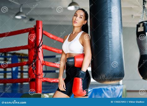 Sporty Young Woman Wearing Boxing Gloves Posing In Gym Stock Image Image Of Female Athlete