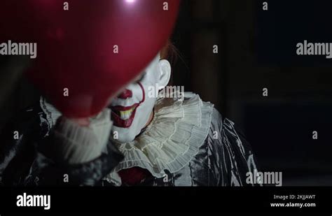 Evil Clown In Dark Scary Halloween Horror Scene Frightening With