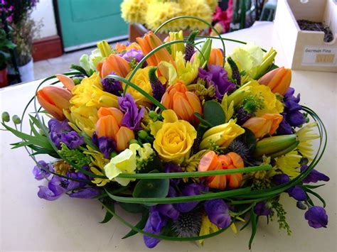 Spring Posy Arrangement With Tulips And Roses In Yellow Orange And