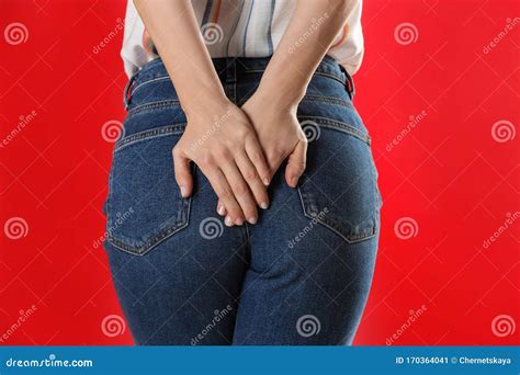 Woman Suffering From Hemorrhoid On Red Background Closeup Stock Image Image Of Hemorrhoid