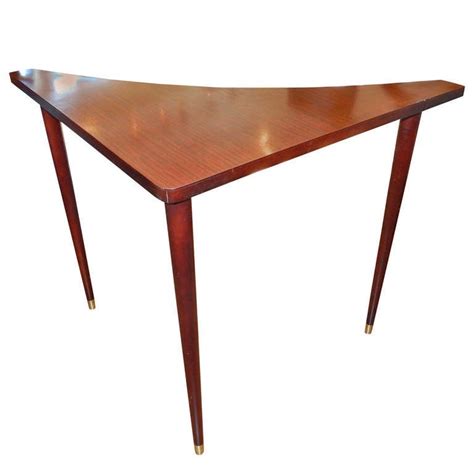 It was a time when new materials such as plastic, stainless steel, and lucite were incorporated into furniture pieces, and new techniques were enthusiastically. A Danish Mid-Century Sofa Corner Table at 1stdibs