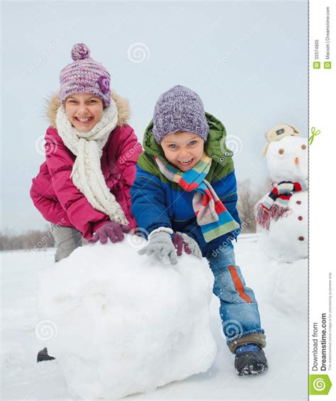 Download 242 time snowmen stock illustrations, vectors & clipart for free or amazingly low rates! Kids Make A Snowman Royalty Free Stock Photo - Image: 33374905