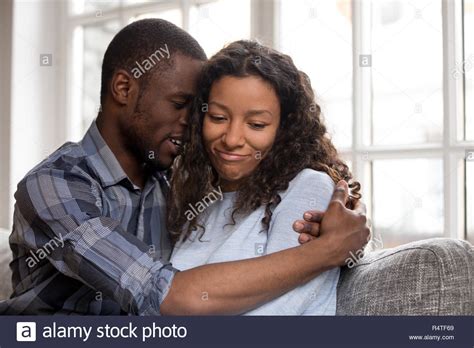 Loving African American Husband Embracing Wife After Quarrel Stock