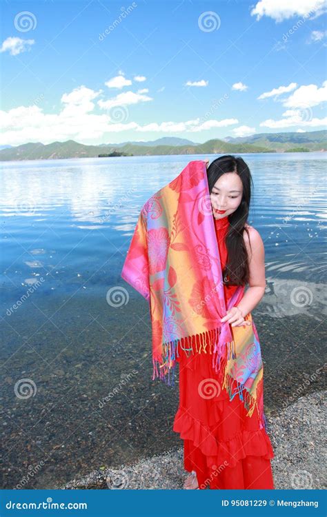 Asian Chinese Beauty In Red Dress With Red Scraf On Head At Yunnan