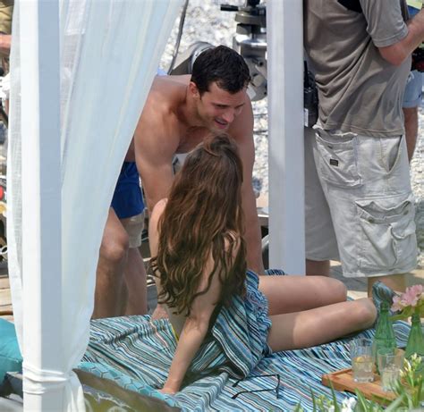 Dakota Johnson Topless Paparazzi Photos Jamie Dornan Is Covering Her Nude Tits Scandal Planet