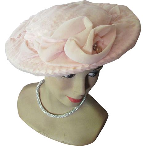 Wide Brim Hat In Cameo Pink Cellophane Weave Draped In Net Decorated