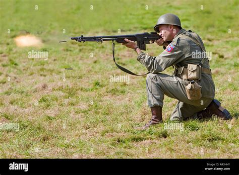 Kneeling Soldier Firing Semi Automatic Rifle Stock Photo Alamy