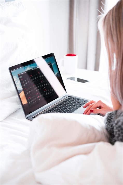 Young Woman Using Her Laptop In Bed Free Stock Photo Picjumbo