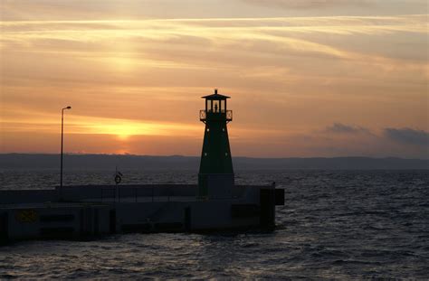 Free Images Beach Coast Ocean Horizon Cloud Lighthouse Sunrise