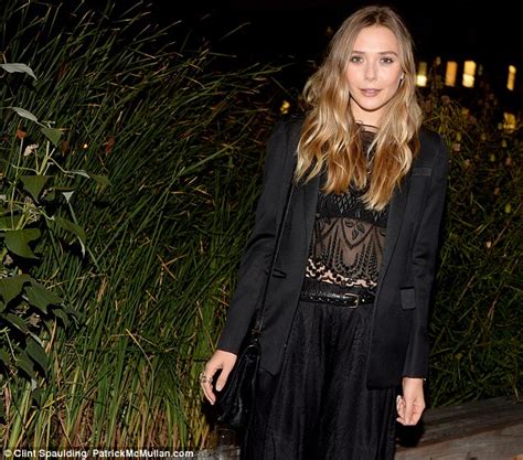 Elizabeth Olsen Shows A Hint Of Midriff In Chic Blouse By Her Sisters Label The Row Daily