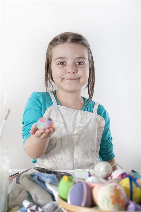 A Happy Little Girl Painting Easter Eggs Stock Photo Image Of Easter