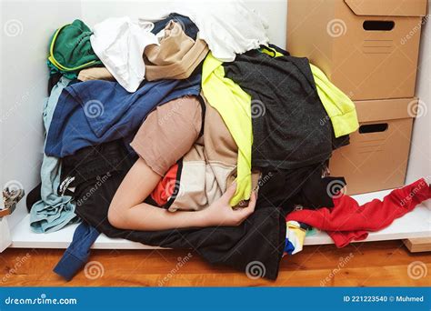 Babe With Messy Stack Of Clothes Things On Floor Home Chores Housework Stock Photo Image Of