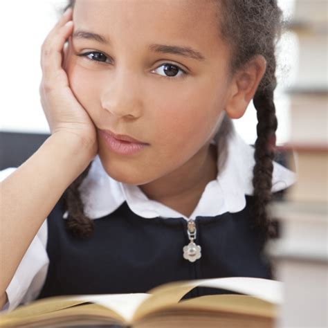 African American Mixed Race School Girl Reading A Book License