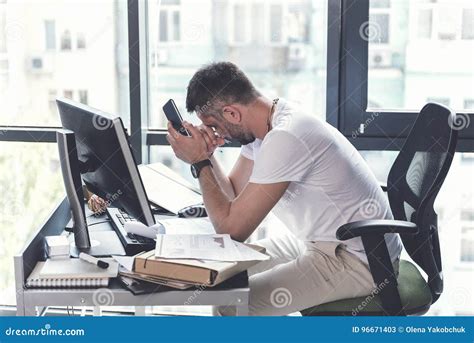 Exhausted Mature Employee Is Sitting At Desk Stock Image Image Of