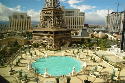 $20 upgraded to 2 queen beds with fantastic view of strip, bellagio, eiffel tower and the swinning pool. Paris Pool | paris las vegas pool , las vegas ...